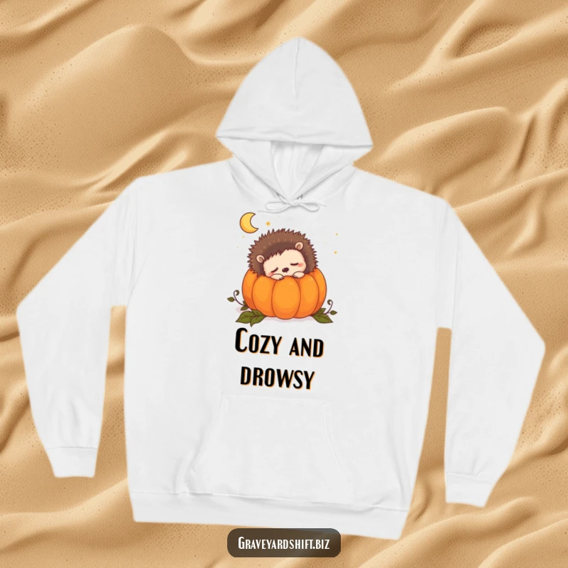 Funny sleepy hedgehog hoodie showing a cute hedgehog snuggled peacefully inside a pumpkin, dreaming of the night.
