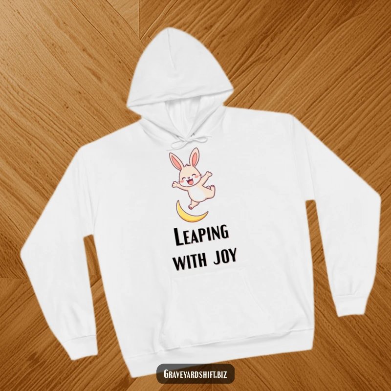 Funny energetic rabbit hoodie showing a rabbit joyfully leaping over a tiny crescent moon, symbolizing fun and energy.