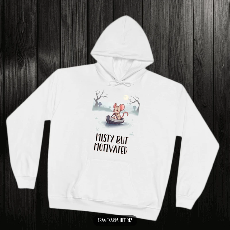 Funny determined mouse steering a tiny boat across a misty graveyard lake, printed on a soft hoodie.