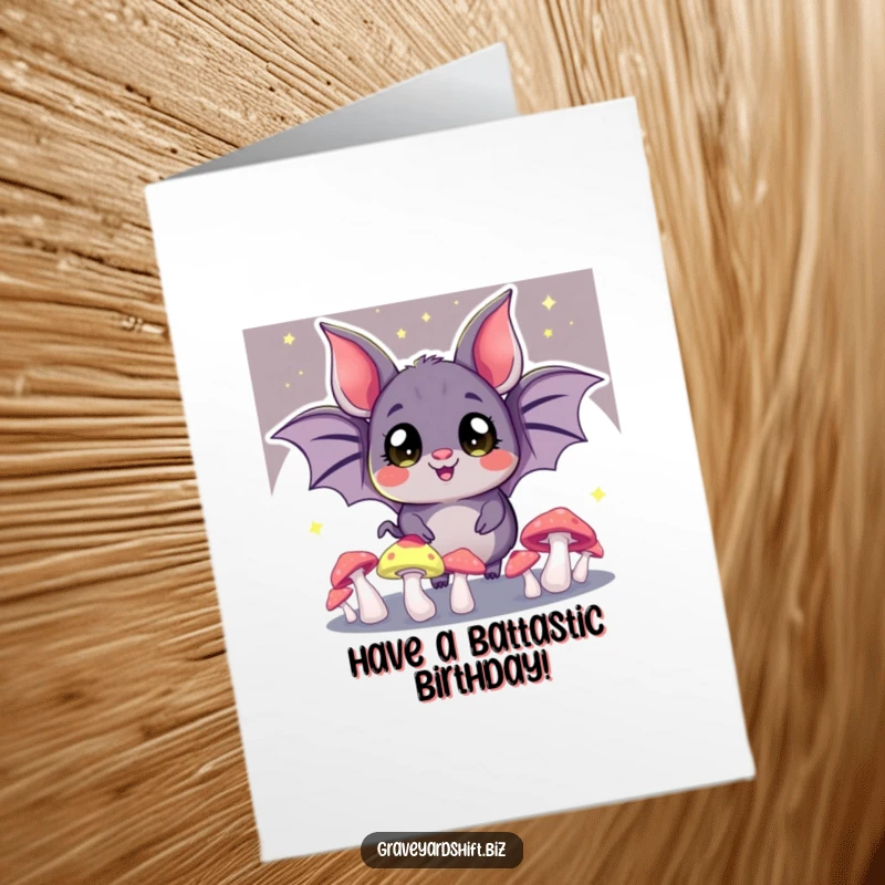 Funny Free Printable Bat Birthday Card: A cheerful bat with wide eyes juggles glowing mushrooms, bringing a luminous glow to birthday wishes.