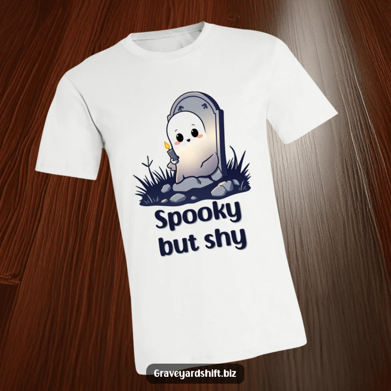 Funny shy ghost t-shirt peeking from tombstone, holding flickering candle, ideal for spooky and humorous casual wear.